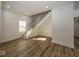 Modern staircase with metal railing and hardwood floors at 1666 Union St, Indianapolis, IN 46225