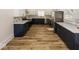 Modern kitchen features dark cabinetry, quartz countertops, and stainless steel appliances at 1666 Union St, Indianapolis, IN 46225