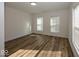 Bright and airy bedroom with hardwood floors and large windows at 1666 Union St, Indianapolis, IN 46225