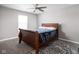 Cozy bedroom with a wooden bed frame and patterned rug at 6429 Flag Stop Dr, Whitestown, IN 46075