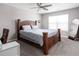 Comfortable bedroom with a wooden bed frame and ceiling fan at 6429 Flag Stop Dr, Whitestown, IN 46075