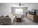 Spacious bonus room with sectional sofa and large TV at 6429 Flag Stop Dr, Whitestown, IN 46075