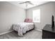 Cozy bedroom with a full-size bed, a dresser, and a window with blinds at 6429 Flag Stop Dr, Whitestown, IN 46075