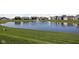Enjoy a peaceful community pond with a fountain, surrounded by homes and lush landscaping at 6429 Flag Stop Dr, Whitestown, IN 46075