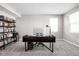 Home office with desk, bookcase, and window at 6429 Flag Stop Dr, Whitestown, IN 46075