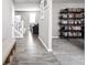 Spacious hallway with hardwood floors and built-in shelving at 6429 Flag Stop Dr, Whitestown, IN 46075