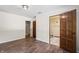 Bedroom with hardwood floors and en-suite bathroom at 6470 Around The Hills Rd, Indianapolis, IN 46226