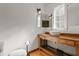 Modern bathroom with a floating sink and wooden vanity at 6470 Around The Hills Rd, Indianapolis, IN 46226
