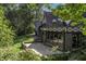 Large patio with stunning architectural details and lush greenery at 6470 Around The Hills Rd, Indianapolis, IN 46226