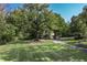 Long winding driveway leading to a home nestled in the woods at 6470 Around The Hills Rd, Indianapolis, IN 46226