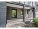 Front entrance with stone facade, black door, and stone steps at 6470 Around The Hills Rd, Indianapolis, IN 46226