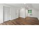 Well-lit bedroom with hardwood floors and a window at 6470 Around The Hills Rd, Indianapolis, IN 46226