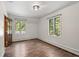 Well-lit bedroom with hardwood floors and wood doors at 6470 Around The Hills Rd, Indianapolis, IN 46226