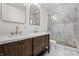 Elegant bathroom with marble tile and double vanity at 6470 Around The Hills Rd, Indianapolis, IN 46226