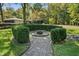 Landscaped area with fire pit and brick pathway at 6470 Around The Hills Rd, Indianapolis, IN 46226