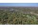 Aerial view of a community with lush trees and a lake at 6470 Around The Hills Rd, Indianapolis, IN 46226