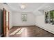 Bright bedroom with hardwood floors and ample natural light at 6470 Around The Hills Rd, Indianapolis, IN 46226
