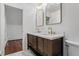 Modern bathroom with double vanity and arched mirrors at 6470 Around The Hills Rd, Indianapolis, IN 46226