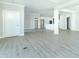 Open concept living and kitchen area with gray flooring at 4435 W Preserve Pass, New Palestine, IN 46163