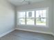 Bright office features large window with neighborhood view and grey vinyl plank flooring at 4435 W Preserve Pass, New Palestine, IN 46163