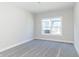 Simple bedroom with grey carpet and window at 4435 W Preserve Pass, New Palestine, IN 46163