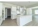 Modern kitchen with white cabinets, stainless steel appliances and quartz countertops at 4435 W Preserve Pass, New Palestine, IN 46163