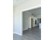 Open dining room with view into kitchen and grey vinyl plank flooring at 4435 W Preserve Pass, New Palestine, IN 46163