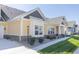 Two-story townhome with yellow siding, white trim, and a two-car garage at 4435 W Preserve Pass, New Palestine, IN 46163