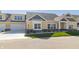 Two-story townhome with yellow siding, gray accents, and a two-car garage at 4435 W Preserve Pass, New Palestine, IN 46163