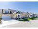 Row of townhomes with yellow siding, gray accents, and two-car garages at 4435 W Preserve Pass, New Palestine, IN 46163