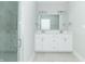 Bathroom boasts double vanity, large mirror, and a glass shower at 4435 W Preserve Pass, New Palestine, IN 46163