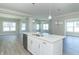 Kitchen island with quartz countertop, double sink and stainless steel dishwasher at 4435 W Preserve Pass, New Palestine, IN 46163