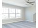 Spacious bedroom with large window and ceiling fan at 4435 W Preserve Pass, New Palestine, IN 46163