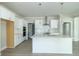 Modern kitchen with white cabinets, stainless steel appliances and quartz countertops at 4435 W Preserve Pass, New Palestine, IN 46163
