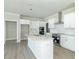 Modern kitchen with white cabinets, stainless steel appliances and quartz countertops at 4435 W Preserve Pass, New Palestine, IN 46163