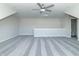 Bright bonus room featuring a ceiling fan and grey carpet at 4435 W Preserve Pass, New Palestine, IN 46163