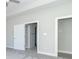 Main bedroom with grey carpet, double door entry to bathroom and closet at 4435 W Preserve Pass, New Palestine, IN 46163