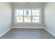 Bright office features large window with neighborhood view and grey vinyl plank flooring at 4435 W Preserve Pass, New Palestine, IN 46163