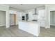 Modern kitchen with white cabinets, stainless steel appliances and quartz countertops at 4435 W Preserve Pass, New Palestine, IN 46163