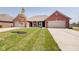 Brick ranch home with two-car garage and landscaped yard at 2843 Grandview Ln, Greenwood, IN 46143