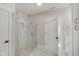 Bathroom with a large walk-in shower and pebble stone floor at 2843 Grandview Ln, Greenwood, IN 46143