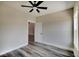 Bedroom with wood-look flooring, ceiling fan, and two windows at 2843 Grandview Ln, Greenwood, IN 46143