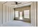 Sunroom with windows, wood-look flooring, and ceiling fan at 2843 Grandview Ln, Greenwood, IN 46143