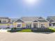 Craftsman style home with gray and yellow siding, two-car garage, and landscaped yard at 4435 W Preserve Pass, New Palestine, IN 46163