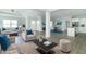 Open floor plan connecting living room, kitchen, and dining areas at 4435 W Preserve Pass, New Palestine, IN 46163