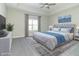 Spacious main bedroom with gray upholstered bed and blue accents at 4435 W Preserve Pass, New Palestine, IN 46163