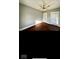 Bright bedroom with hardwood floors and ceiling fan at 8185 N State Road 39, Lebanon, IN 46052