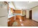 Kitchen with wood cabinets, laminate countertops and hardwood floors at 9490 N 700 E, Indianapolis, IN 46259