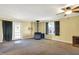 Living room with carpet, a wood-burning stove, and a door leading outside at 9490 N 700 E, Indianapolis, IN 46259
