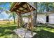 Wooden swing set with a covered shelter at 9490 N 700 E, Indianapolis, IN 46259
